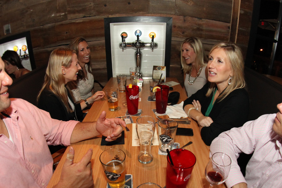 People sitting at a table in a restaurant.
